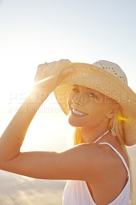 Buy stock photo Portrait, sunset and woman on beach with hat for sunshine, summer vacation and natural environment. Holiday travel, happy tourist girl and relax for peaceful walk and tropical adventure in Mexico