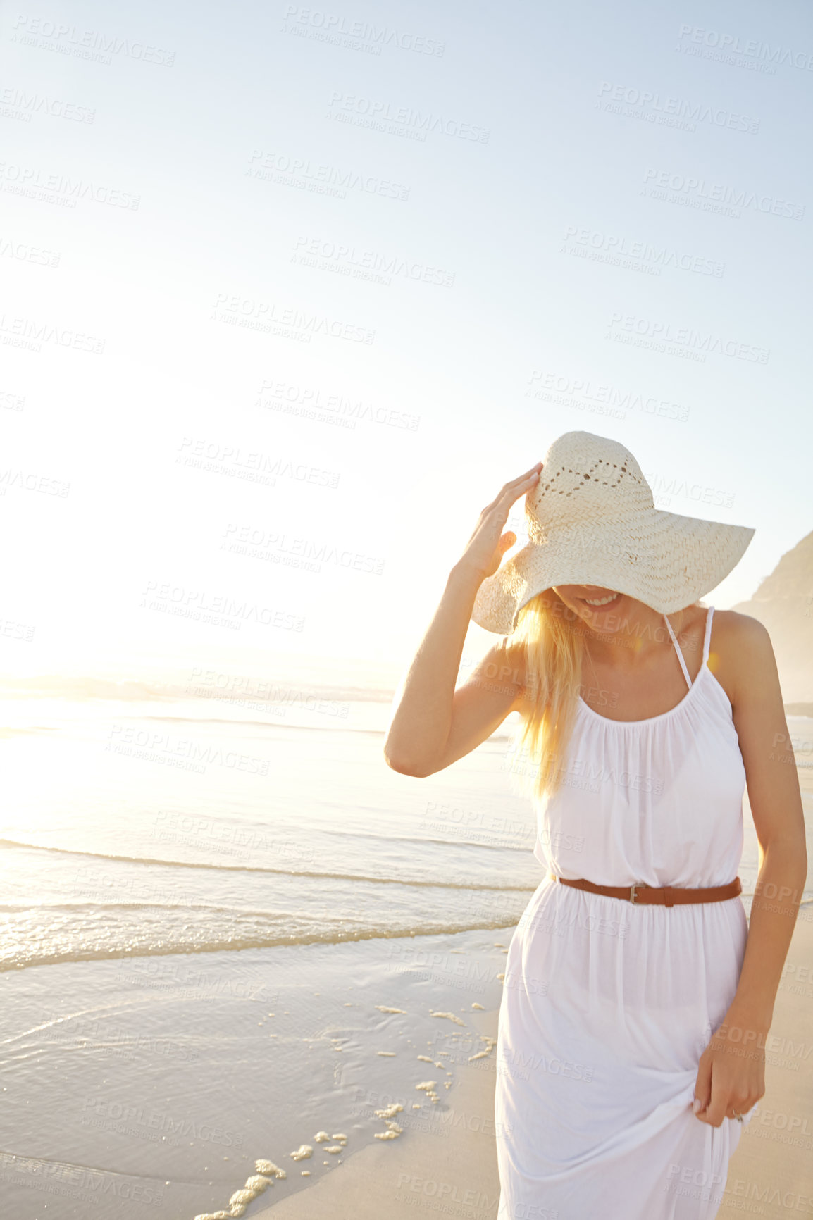 Buy stock photo Smile, beach and woman in nature with hat for summer vacation, holiday trip or tropical getaway. Travel, outdoor and person on coastline for happiness, weekend adventure or journey to Mexico