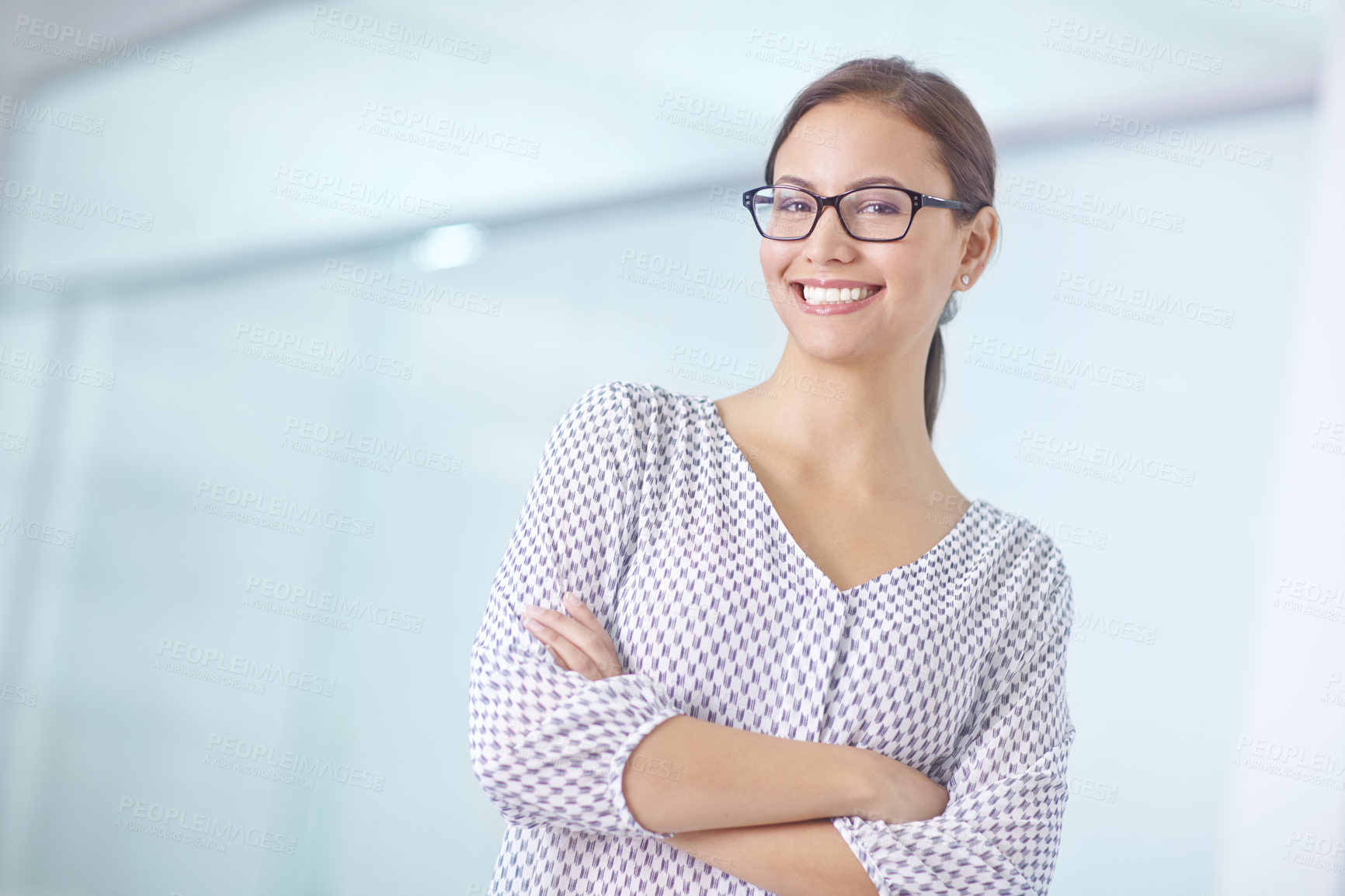 Buy stock photo Arms crossed, portrait and smile with woman employee in hallway of office for start of career. Business, company and happy with confident designer in creative workplace for project management