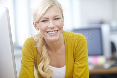 Buy stock photo Portrait of a young woman sitting at her desk in an office