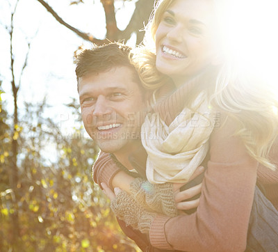 Buy stock photo Happy, couple and piggyback with smile in forest for outdoor adventure, break and love in morning. Man, woman and relax with affection in nature for anniversary, tourism and weekend in New Zealand