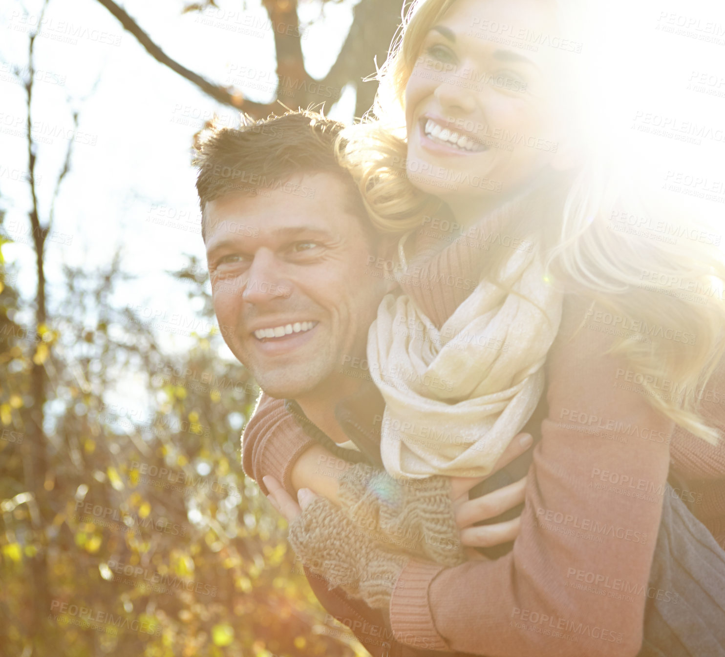 Buy stock photo Happy, couple and piggyback with smile in forest for outdoor adventure, break and love in morning. Man, woman and relax with affection in nature for anniversary, tourism and weekend in New Zealand