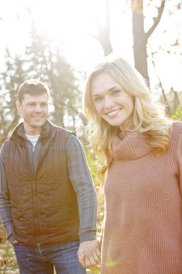 Buy stock photo Happy man, woman and portrait in forest for holding hands and adventure or love in woods or park. Couple, smile and together in nature for outdoor date, travel and romance in morning for anniversary 