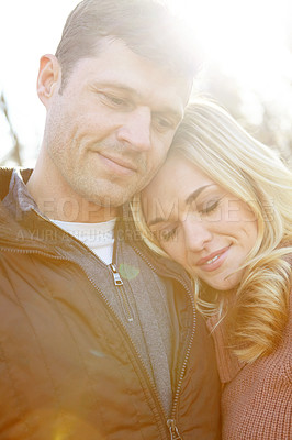 Buy stock photo Hug, couple and love in nature with support for adventure and date in park or countryside. Man, woman and smile or together for embrace, relax and happy in morning for anniversary, care or wellness