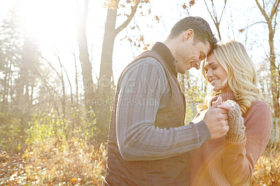 Buy stock photo Holding hands, smile and couple in park with love or romance on vacation, valentines day and holiday. Forest, forehead and man with woman, peace or embrace for support or bonding together in nature