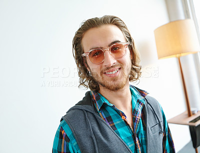 Buy stock photo A portrait of handsome young man in a trendy outfit laughing while standing in a home interior and smiling while looking stylish