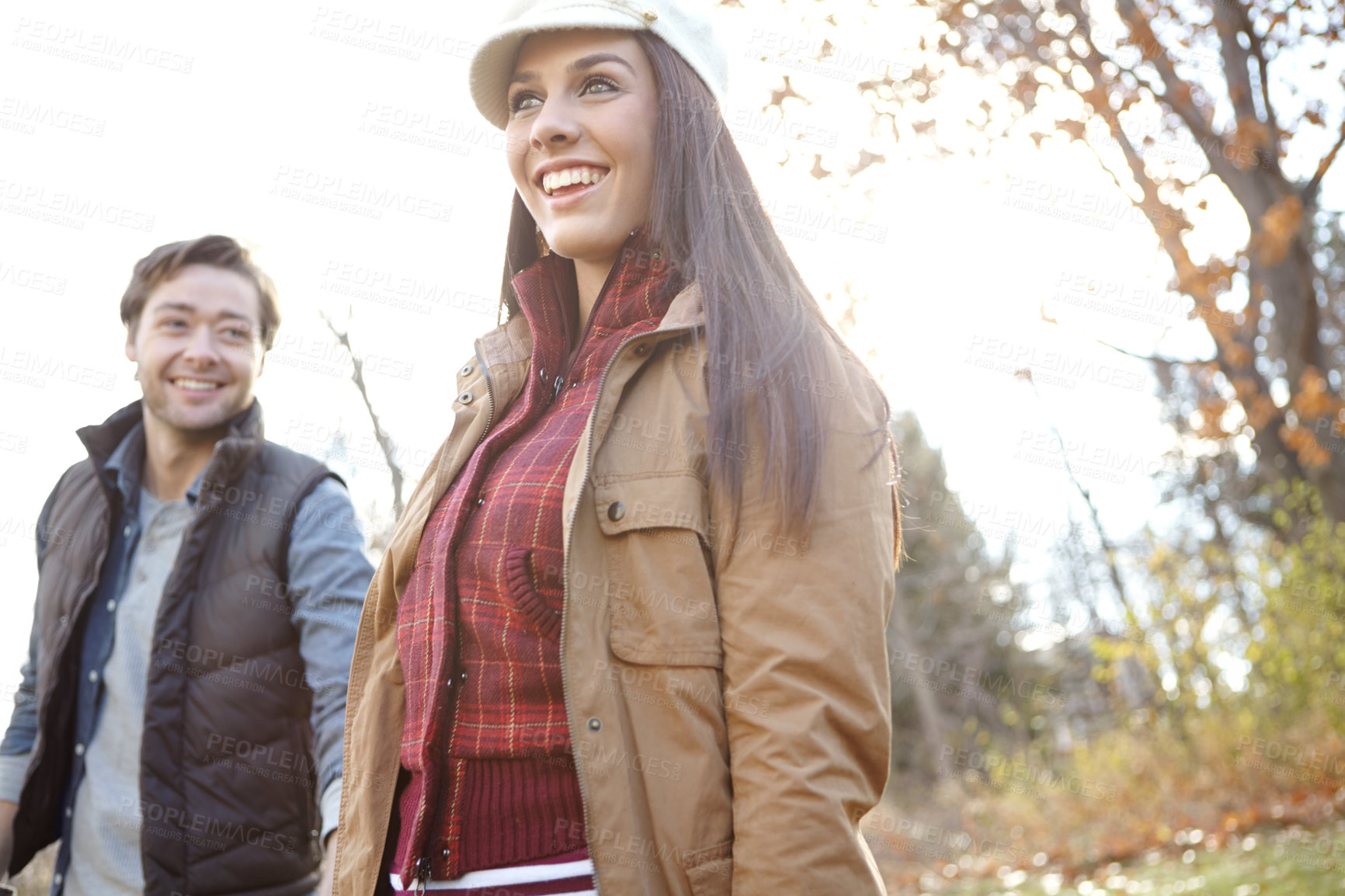 Buy stock photo Woman, man and walk with nature for park trip, bonding or travel in winter countryside. Smile, love and happy couple in holding hands for morning holiday, vacation or woods picnic or hiking adventure