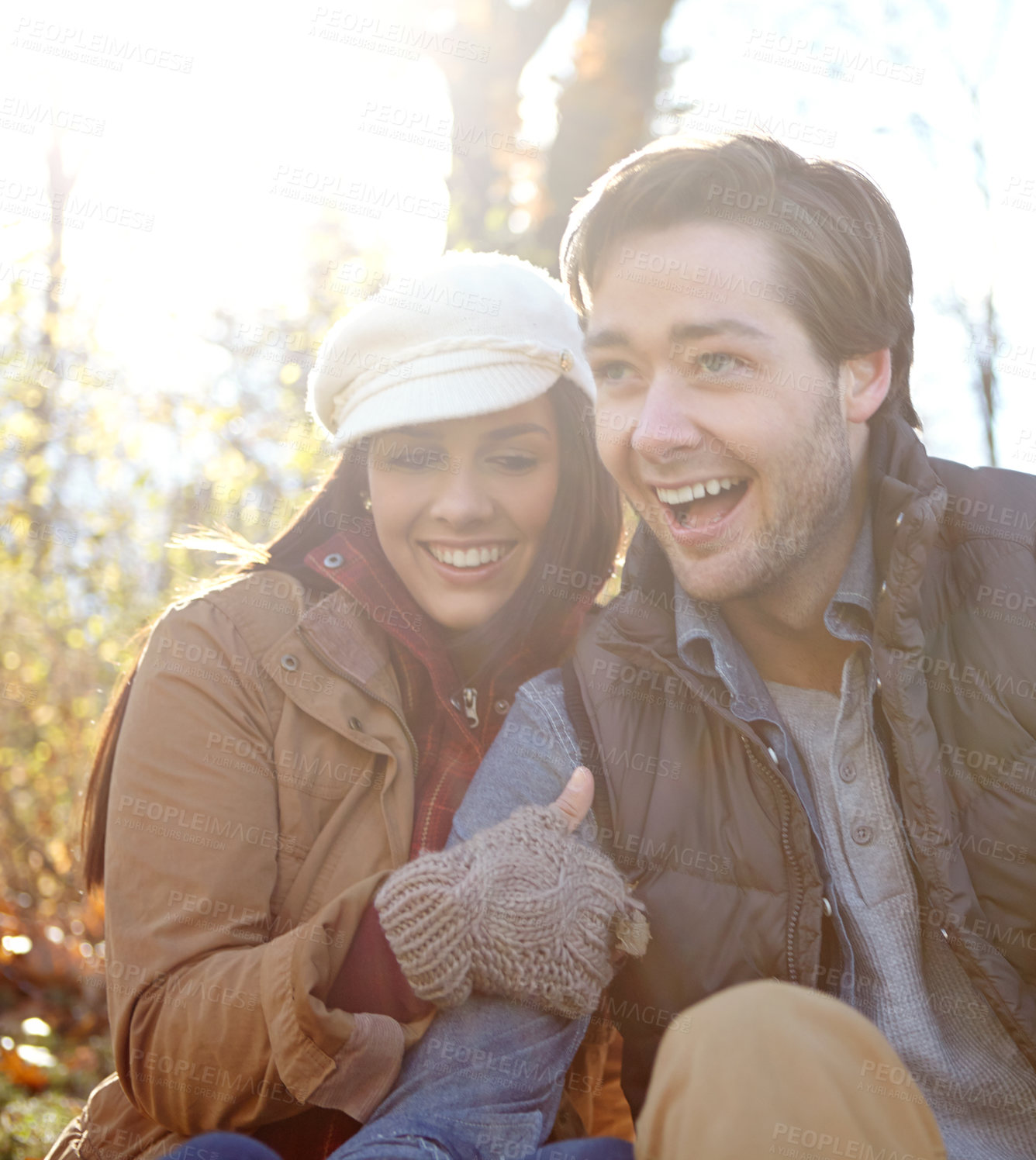 Buy stock photo Couple, laughing and hug on nature date for romance, bonding and outdoor for funny conversation. Happy people, woods and holiday to relax in winter season for love, joke and embrace for security