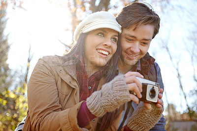 Buy stock photo Nature, man and woman with camera for photography in forest for hiking and camping in woods. Happy, couple or partner and photographer in park for outdoor, travel and memory or together for adventure