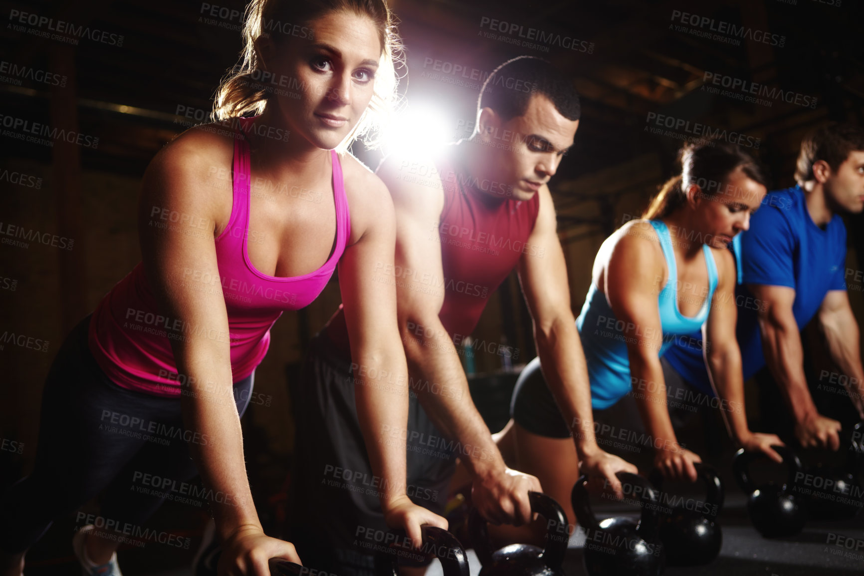 Buy stock photo Push up, woman and man in portrait with dumbbells, support and commitment to body workout. Bodybuilder, group and people together in exercise class with kettlebell, power training and teamwork in gym