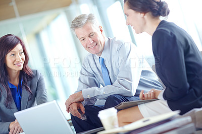 Buy stock photo Talking, meeting and colleagues in office, smile and reading of proposal with client and online. Investor, planning and happy for funding of business, professional and people with report for project