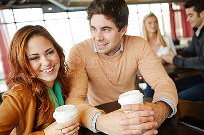 Buy stock photo A happy young couple on a date in a coffee shop
