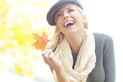 Buy stock photo Happy, autumn and woman with leaf in park for outdoor holiday, vacation and change of season. Environment, female person and smile with foliage in nature for travel, adventure and peace in Canada