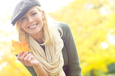 Buy stock photo Woman, happiness and leaf in park during fall season to relax, joyful and fun outdoor on holiday. Female person, portrait and trees in nature in autumn weather for travel, vacation and positive mood