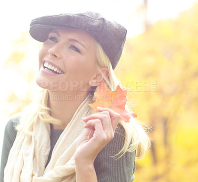 Buy stock photo Woman, thinking and leaf in park during autumn season for idea, joy and relax outdoor on holiday. Female person, vision and trees in nature in fall weather for travel, vacation and positive mood