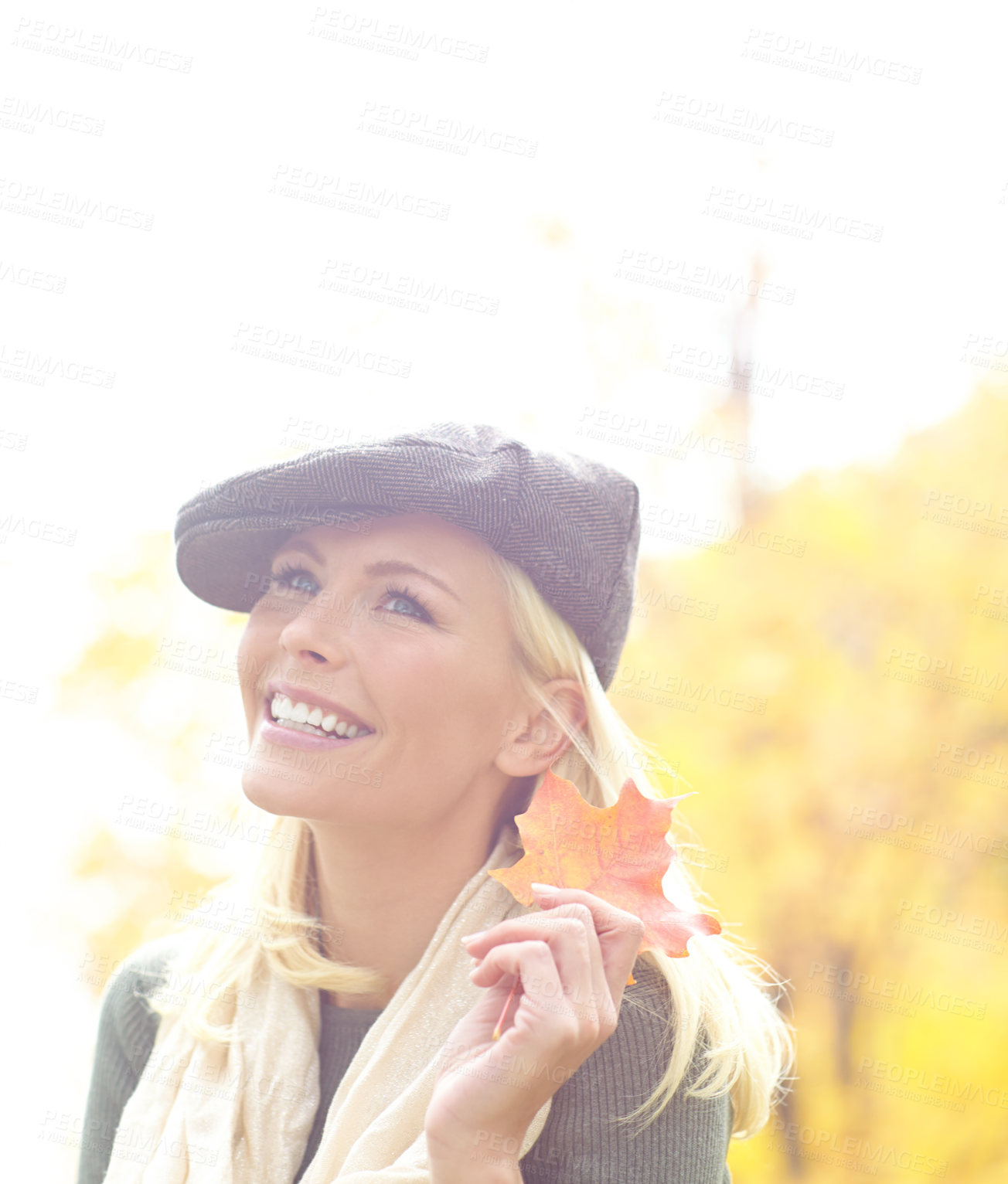 Buy stock photo Woman, thinking and leaf in garden during autumn season for relax, joy and leisure outdoor on holiday. Female person, vision and tree in nature in fall weather for travel, vacation and positive mood