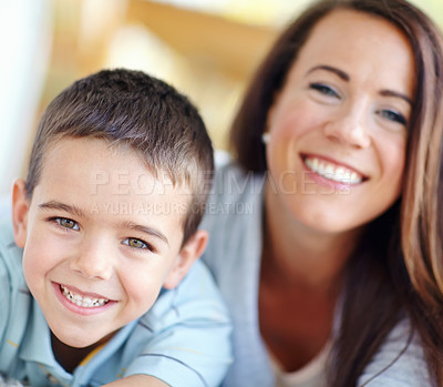 Buy stock photo Mama, son and hug for love, support or family care with bonding for childhood or weekend together at home. Portrait, mother and kid or child with smile for embrace or relax on living room floor