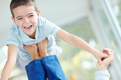 Buy stock photo Portrait, parent and lifting excited child in home with feet for game, face and balance for family support. Happy kid, playing and flying with babysitter in air, holding hands or funny boy laughing