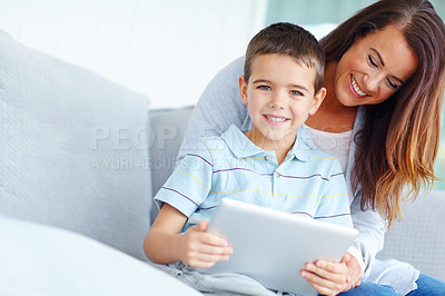 Buy stock photo Mother, child and tablet on sofa for film, online cartoon or internet with entertainment for childhood together at home. Bonding, mom and kid or son with smile with hug and relax on living room couch