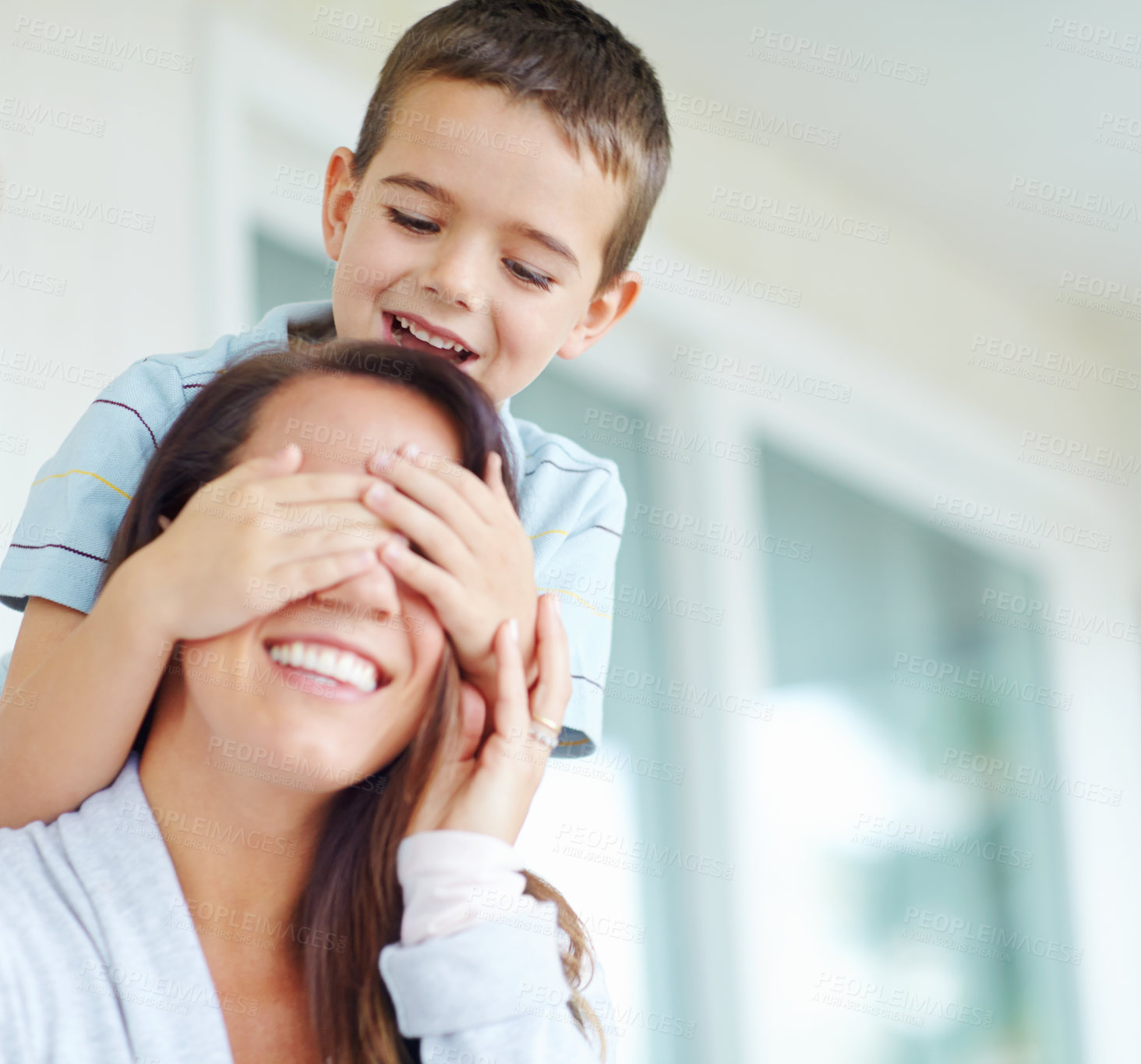 Buy stock photo Playful, mother and eyes with child in home for funny bonding, joke and humor together on weekend. Happy, kid and woman with smile in house for comedy game, support and love of son in morning