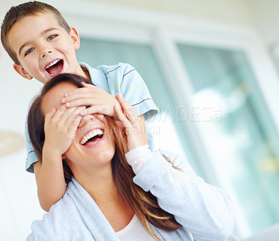 Buy stock photo Playful, mother and eyes with kid in home for funny bonding, joke and humor together on weekend. Happy, woman and child with portrait by house for comedy game, support and love of son in morning