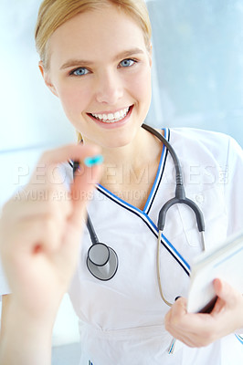 Buy stock photo Nurse, portrait and woman with pill at hospital for healthcare, support or pharmaceutical drug. Happy, professional and person with paper at clinic for medical checklist, prescription and information