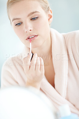 Buy stock photo Mirror, lip gloss and woman with makeup for beauty, morning routine or preparation in home. Reflection, robe and girl with lipstick product for cosmetics, shine and glow aesthetic on mouth in house