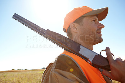 Buy stock photo Man, survival and outdoor nature for hunting, rifle and stalking prey adventure in bush. Mature person, thinking and hunter planning in field for shooting games, profile and tracking gear in sports