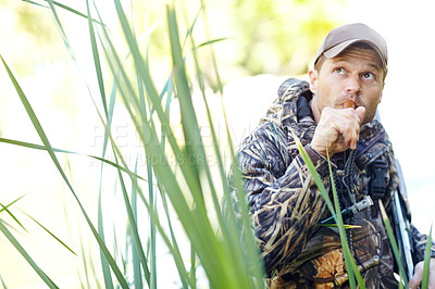 Buy stock photo A hunter holding a duck whistle 