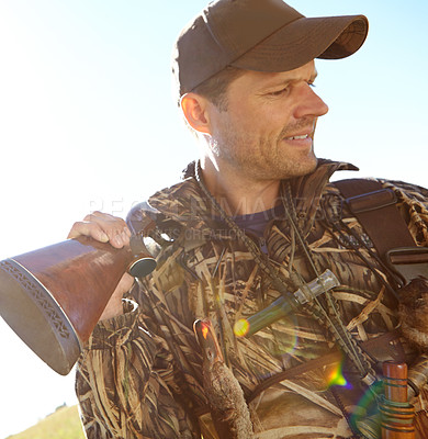 Buy stock photo Man, hunter and rifle in adventure for sport, activity and trophy as wildlife enthusiast. Male person, shotgun and bait for recreation, scouting or camouflage with travel, survival or outdoor for fun