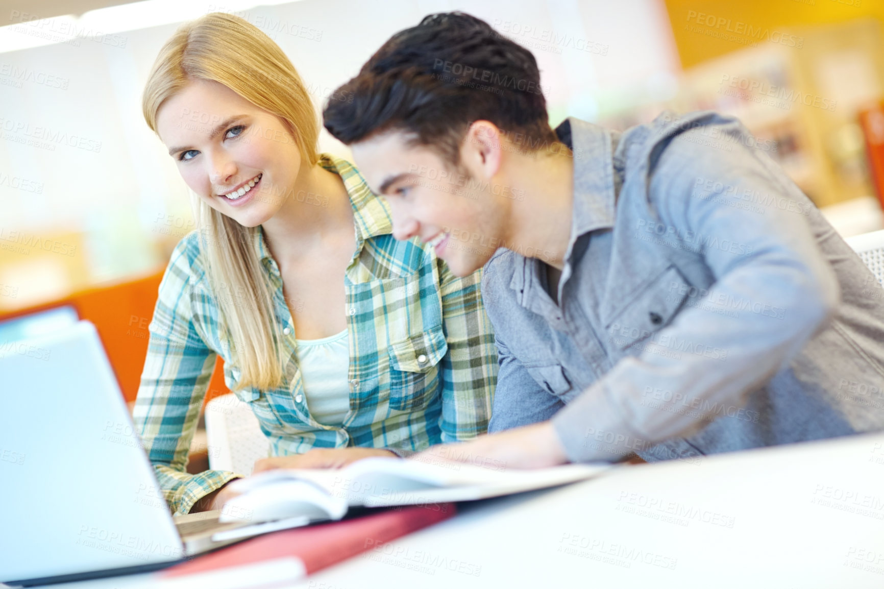 Buy stock photo Education, laptop and study with student friends in library at college or university campus for learning. Computer, development and smile of happy people at school desk for scholarship together