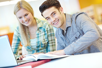 Buy stock photo Education, happy and laptop with student friends in library at college or university campus for learning. Computer, development and study with smile of people at school desk for scholarship together