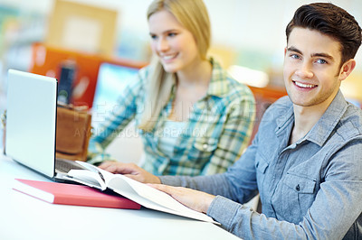 Buy stock photo Education, laptop and portrait of student man in library at college or university campus for learning. Development, reading and study with happy person at school desk or table for scholarship