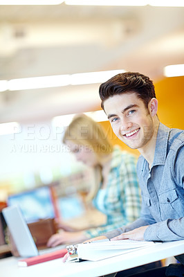 Buy stock photo Education, book and student in library for portrait, learning and studying at table. Happy man, textbook and information in college for exam preparation, reading or research subject for knowledge