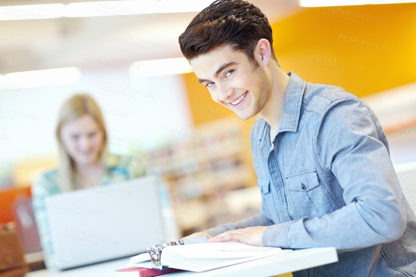 Buy stock photo Education, book and man in college for portrait, learning and studying in library. Happy student, textbook or information in literature for exam preparation, reading or research subject for knowledge
