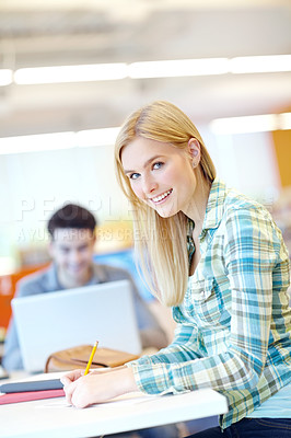 Buy stock photo Education, portrait and writing on notebook in classroom for study group, project or assignment. Female person, smile and pencil for student, course or learning in college, campus or university in UK