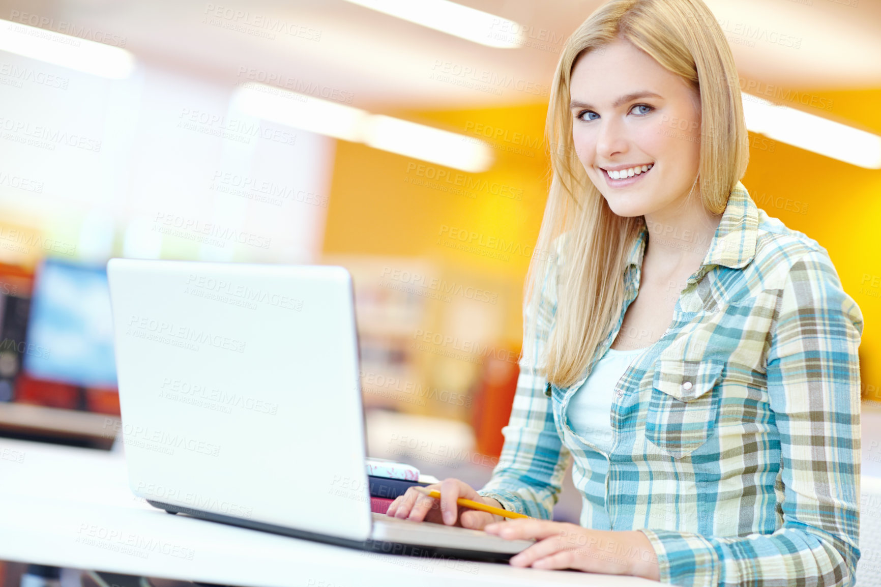 Buy stock photo Girl, college student and portrait with laptop for studying at library, learning and education. Person, woman and computer at university, scroll and happy for info, scholarship or research in Germany