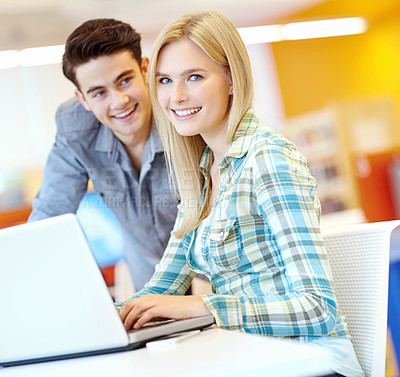 Buy stock photo Students, portrait or laptop in college library for research or higher education for project, studying or teamwork. Friends, man and woman with smile for learning or planning in university in England