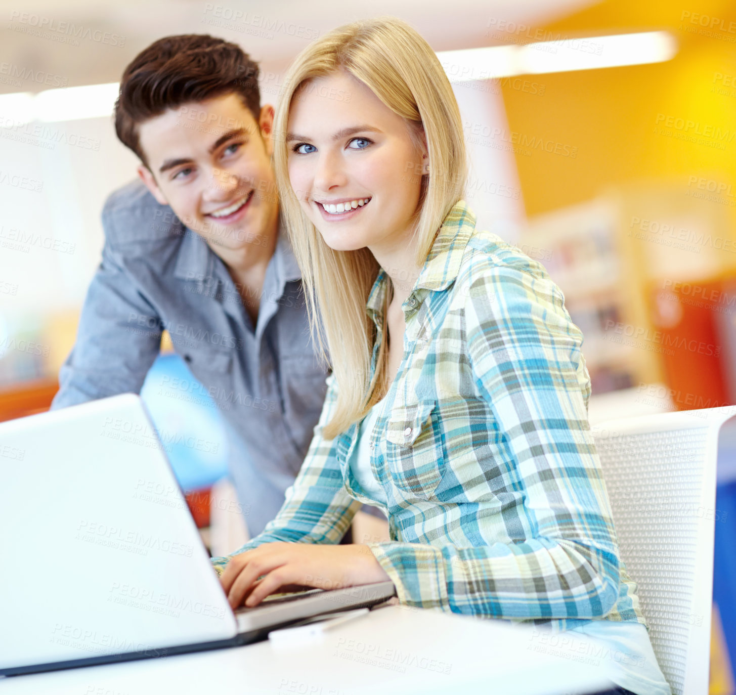 Buy stock photo Students, portrait or laptop in college library for research or higher education for project, studying or teamwork. Friends, man and woman with smile for learning or planning in university in England