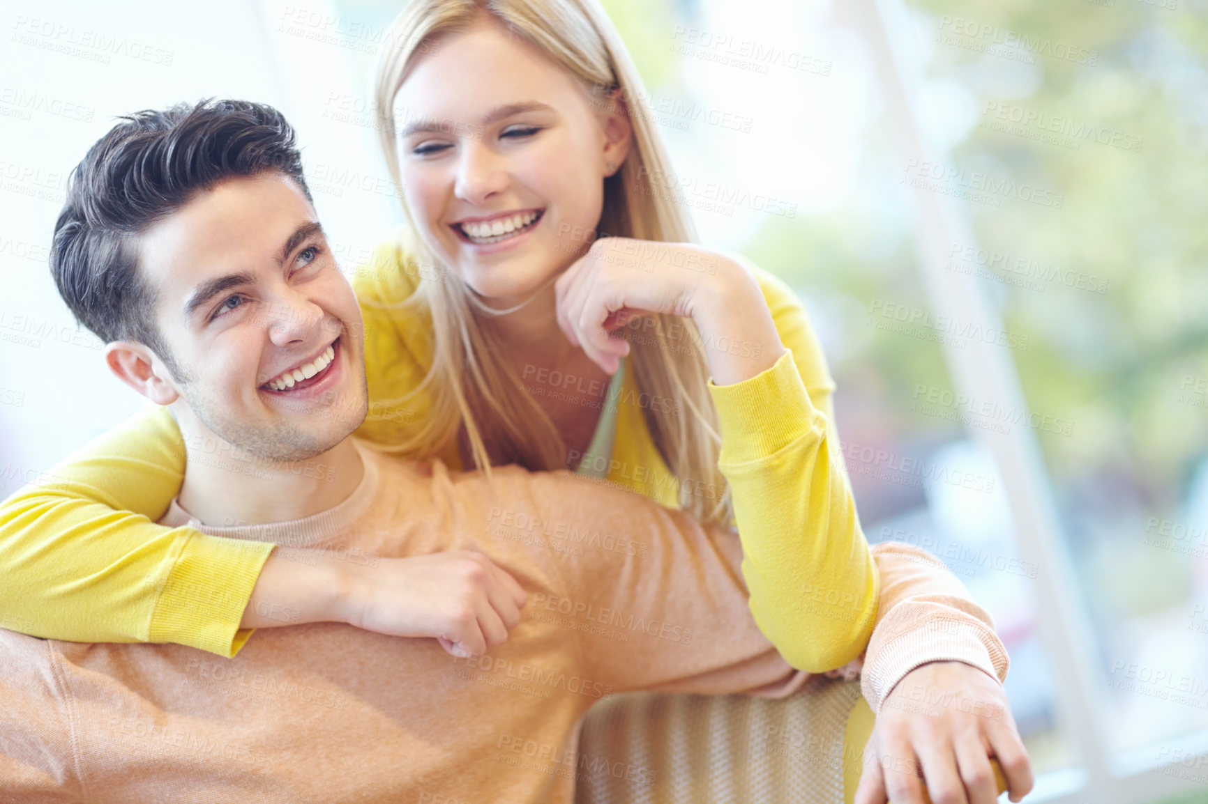 Buy stock photo Love, hug and happy couple in home for connection, support or laughing at funny conversation together. Smile, man and woman embrace in lounge for healthy relationship, trust and commitment to partner