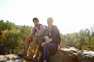 Buy stock photo Rest, portrait or couple hiking in forest for travel, outdoor adventure or journey in nature together. Hikers, woods or people on tree log to relax on holiday vacation, trip or break to explore park