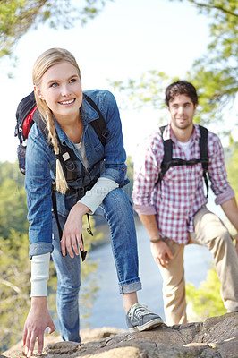 Buy stock photo Hiking, couple and thinking with woman by rocks for outdoor adventure, journey and travel together. Smile, man and happy with backpack by mountain for exploration, trekking and tourism in Argentina