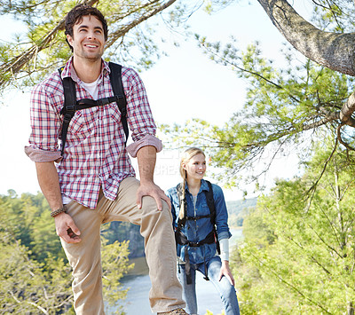 Buy stock photo Peak, view or happy couple hiking in woods for travel, outdoor adventure or journey in nature. Mountain, hikers or people in forest together on holiday vacation, lake trip or break to explore park