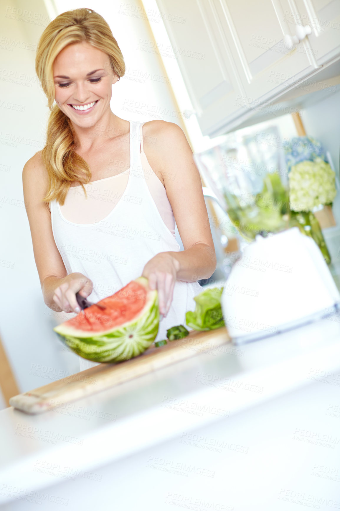 Buy stock photo House, cutting and woman with watermelon, smile and happiness with nutrition, knife and joy. Apartment, person and girl with fruit, prepare for salad and cheerful with diet, wellness and healthy