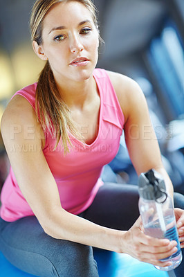 Buy stock photo Gym, woman thinking and ball for fitness with water, liquid beverage and hydration for workout break. Training, female person and thoughts with bottle for mineral H2O, thirst or exercise for wellness