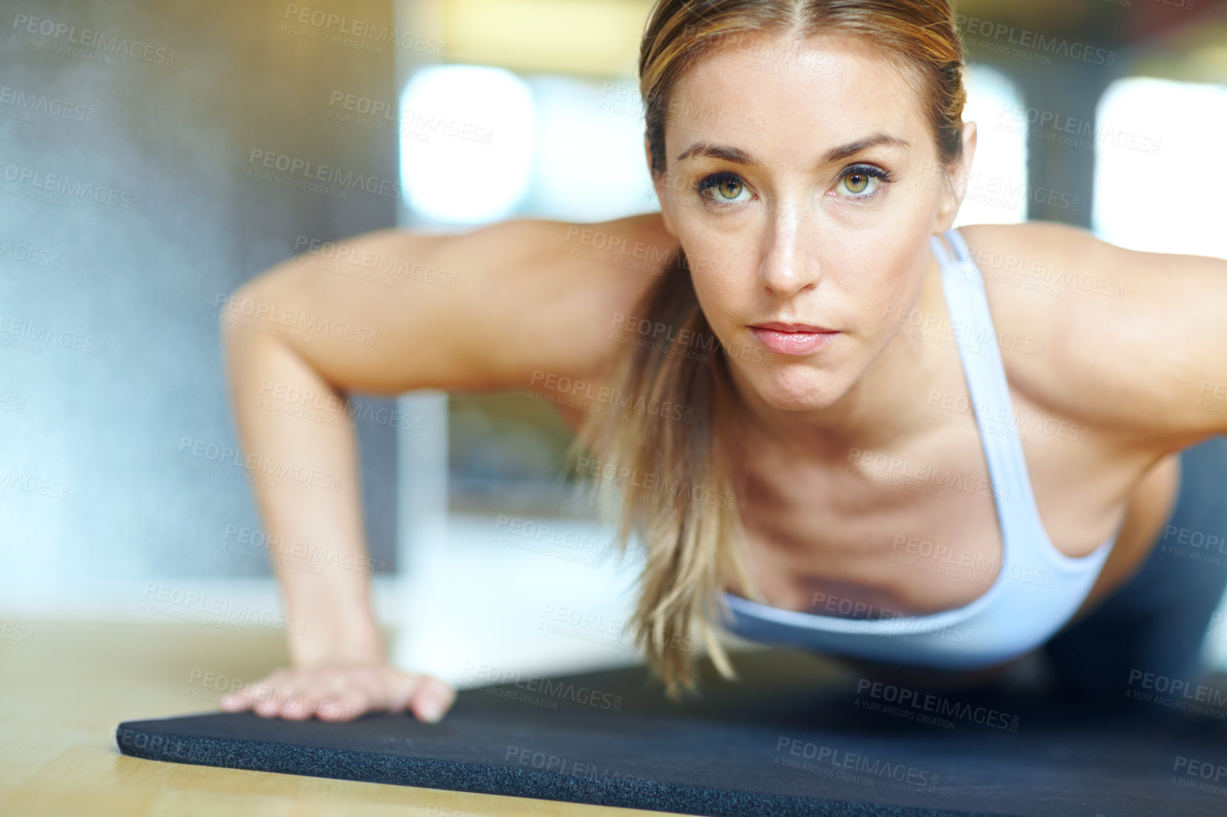 Buy stock photo Yoga mat, fitness and push up with woman in gym for  muscle training, rest and workout. Cardio exercise, strong and sports athlete with person and commitment for energy, wellness and movement