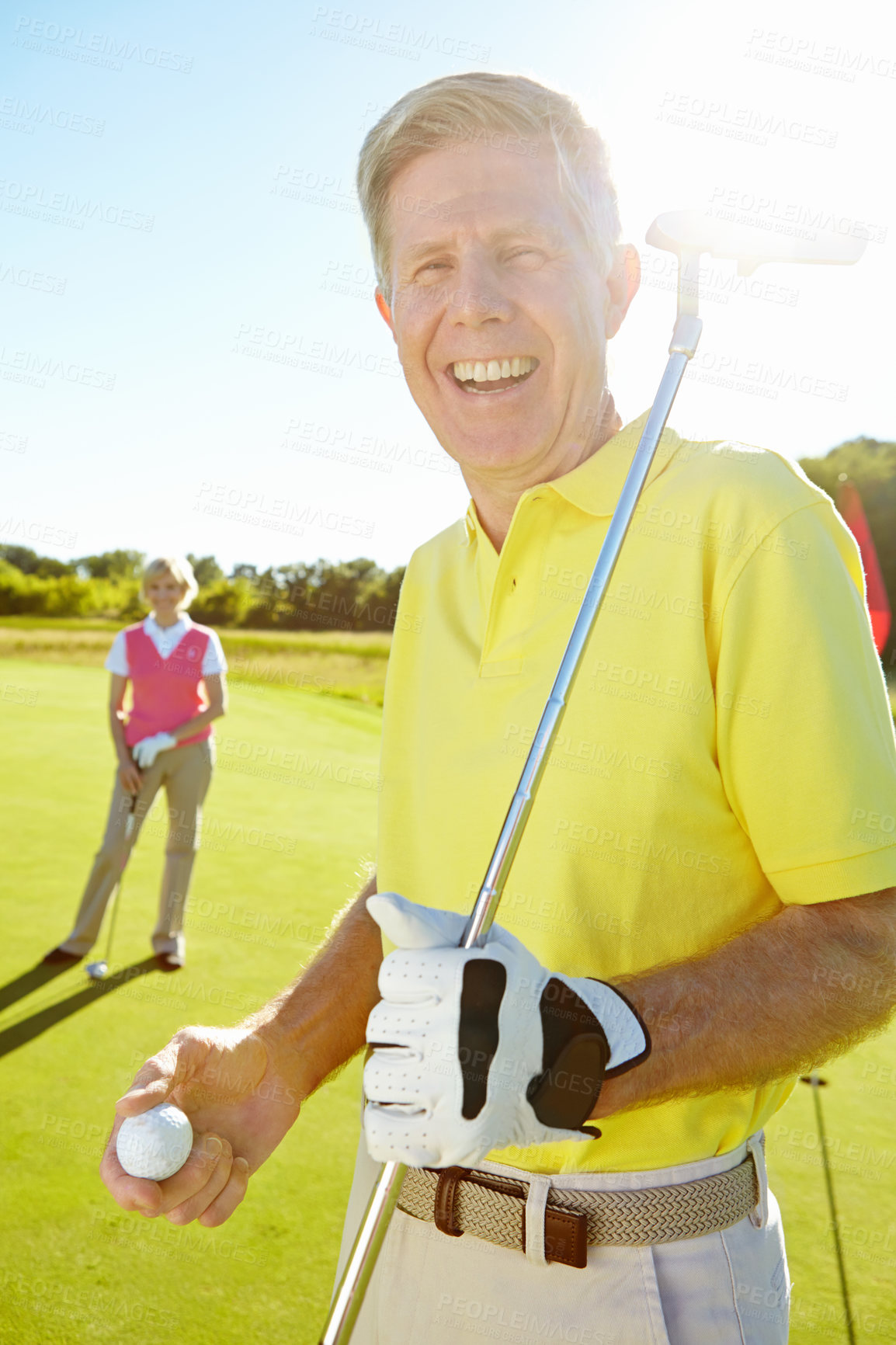 Buy stock photo Senior, portrait and happy man with golf ball or club for game, sports match or outdoor activity on grass field. Mature male person, golfer or player with smile for competition or challenge on course