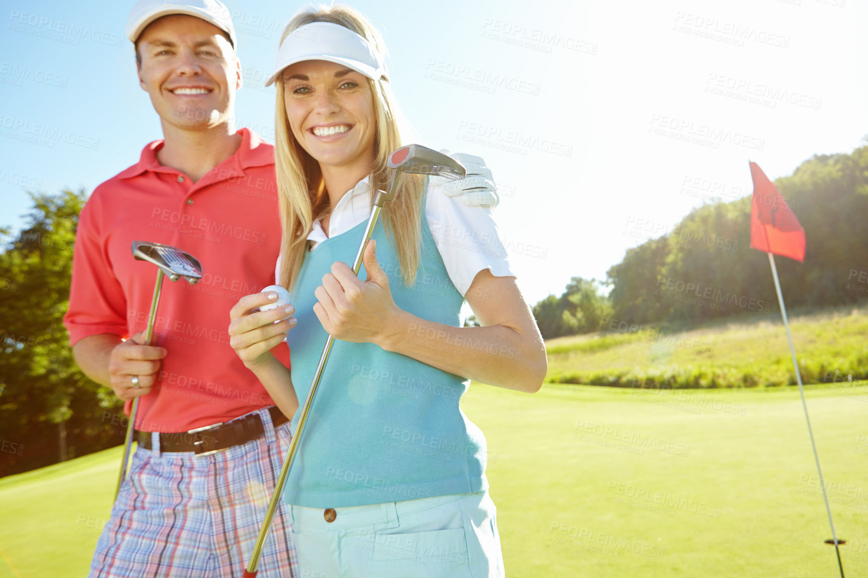 Buy stock photo Happy couple, portrait and sports with golf club or ball for game or friendly outdoor match together on grass field. Young man, woman or golfers with smile for challenge or playful day on lawn