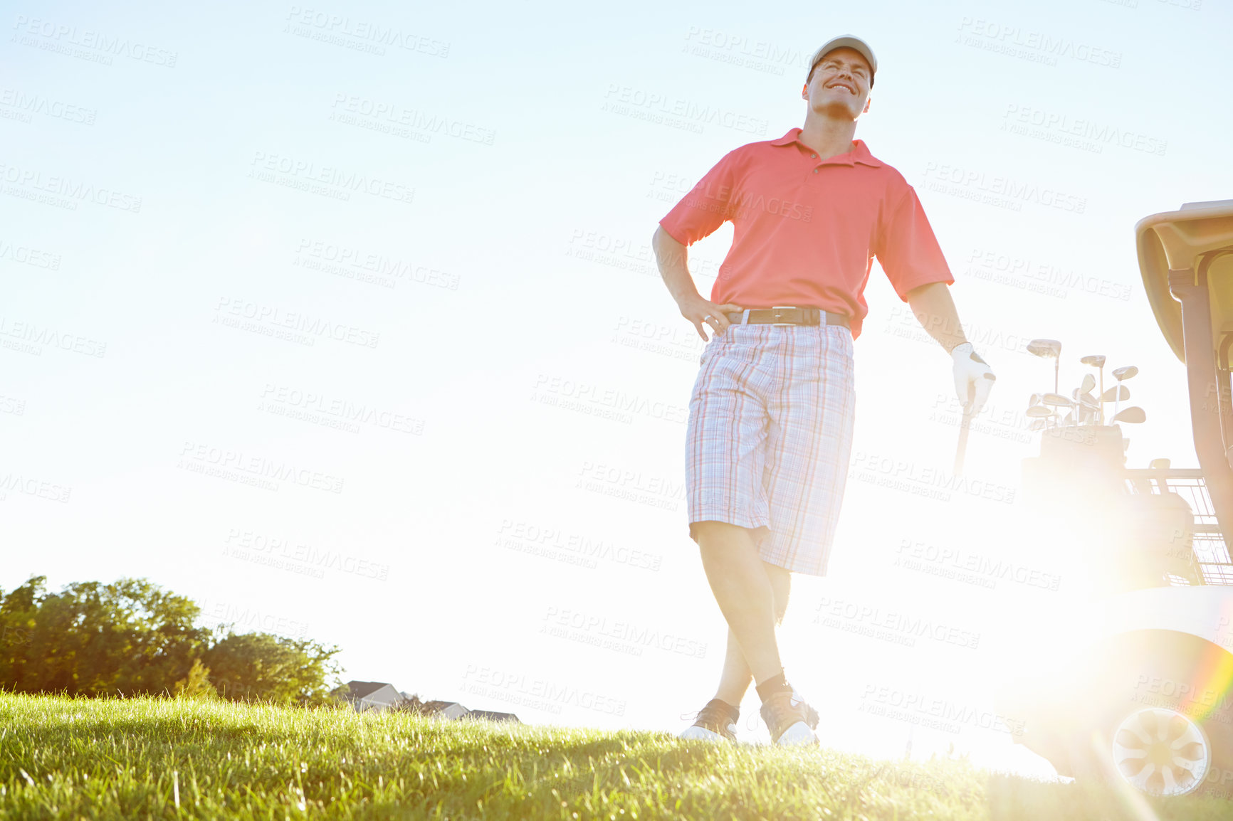 Buy stock photo Sports, golf and man with confidence in morning for winning in game, match and competition. Happy, mockup space and low angle of person with sun flare on grass for training, fitness and practice