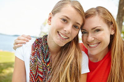 Buy stock photo Portrait, mother and girl with hug, lake and smile with journey, bonding together and care. Face, family and single parent in park, mama, daughter and embrace with weekend break, nature and adventure